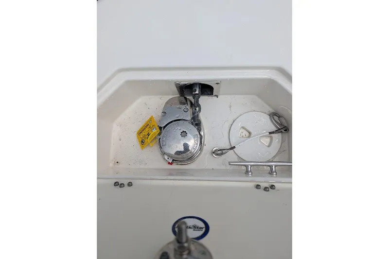Slide: The Image of Anchor compartment of 2020 NauticStar 2602 Legacy boat with winch and cleat. - 15