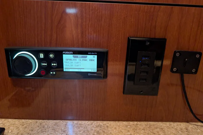 Slide: The Image of Fusion MS-RA70 stereo system and USB ports on 2005 Regal Commodore 3560 IO yacht. - 14