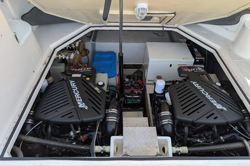 Slide: The Image of Engine compartment of a 2005 Regal Commodore 3560 IO with dual Mercury engines. - 28