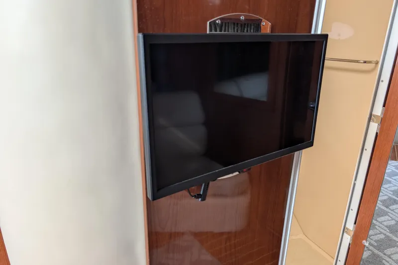Slide: The Image of Flat-screen TV mounted inside 2005 Regal Commodore 3560 IO yacht interior. - 15