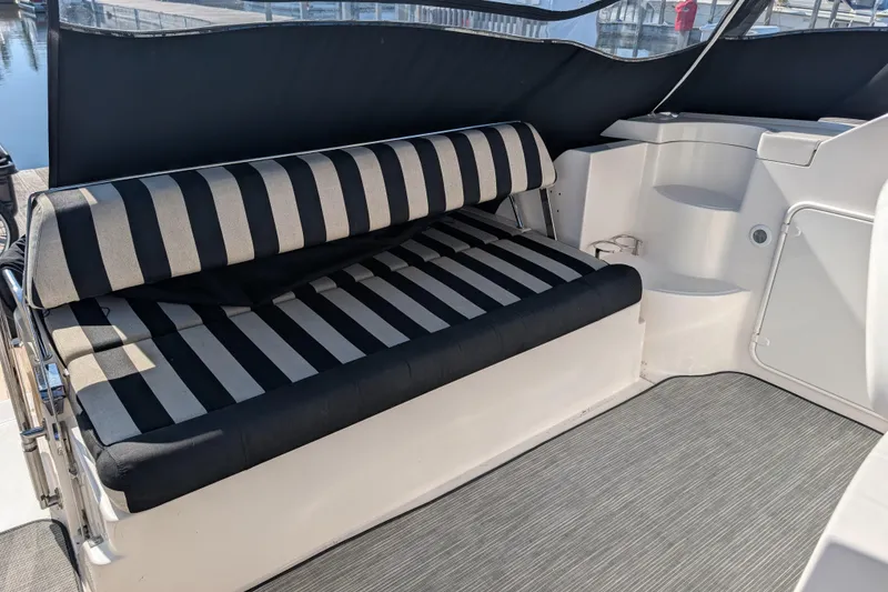 Slide: The Image of Striped seating on 2005 Regal Commodore 3560 IO boat, featuring sleek interior design. - 22