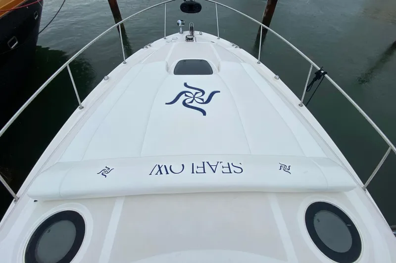 Slide: The Image of 2004 Sea Ray 340 Sundancer boat, top view, docked with "SEAFLOW" branding. - 10