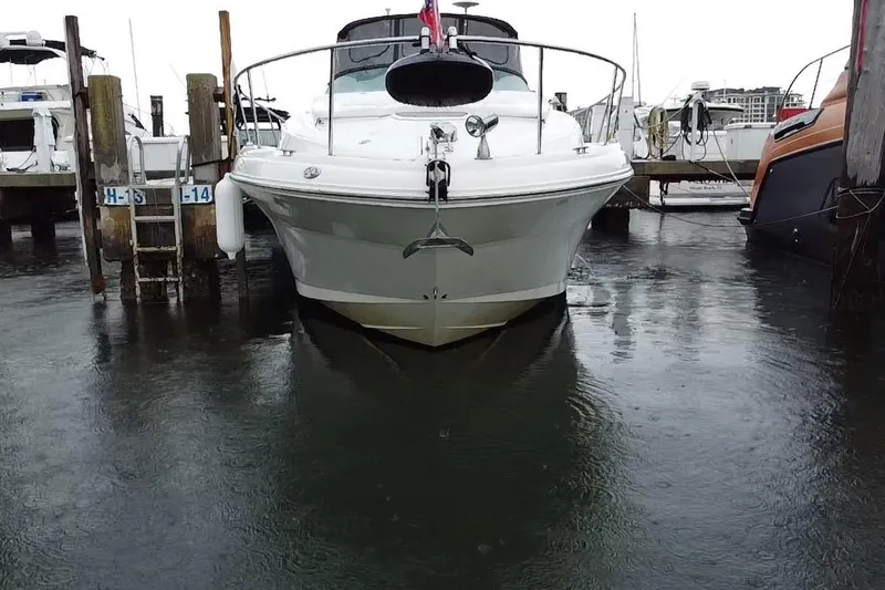 Slide: The Image of 2004 Sea Ray 340 Sundancer docked at marina, front view. - 2