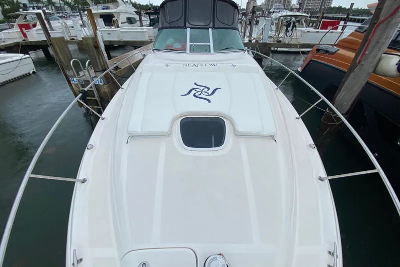 Slide: The Image of 2004 Sea Ray 340 Sundancer docked at marina, view from bow. - 12