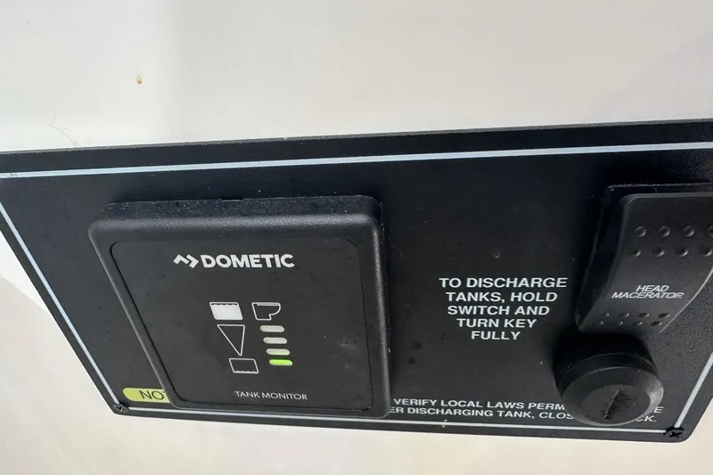 Slide: The Image of Control panel of a 2022 Pursuit OS 325 Offshore boat with Dometic tank monitor. - 36