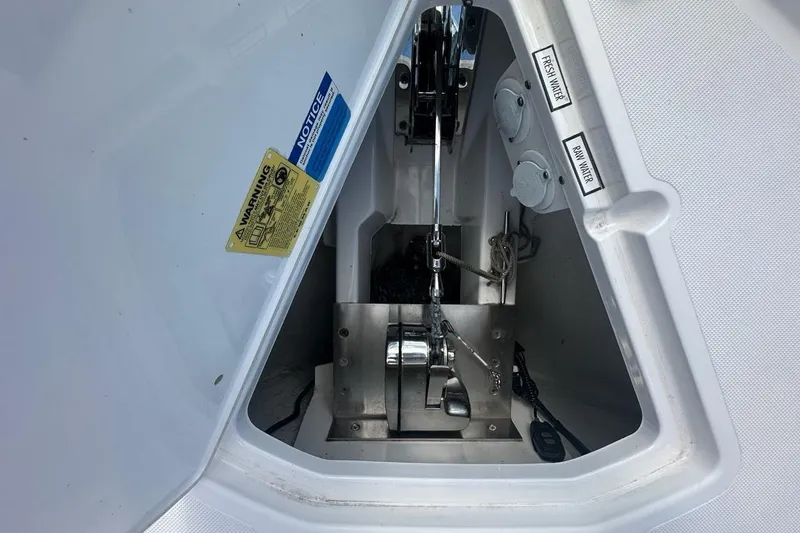 Slide: The Image of Anchor compartment of 2022 Pursuit OS 325 Offshore boat with water access labels. - 54