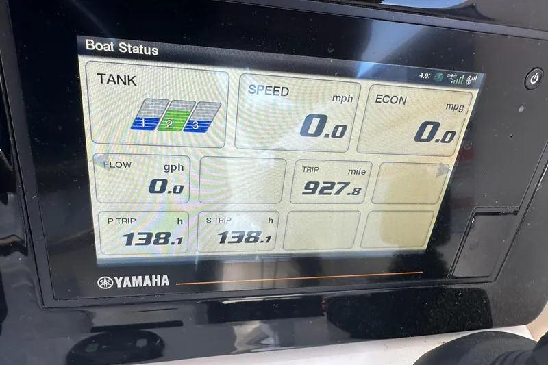 Slide: The Image of Display screen of a 2022 Pursuit OS 325 Offshore boat showing trip and fuel data. - 14