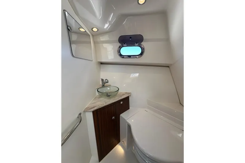 Slide: The Image of Luxurious bathroom interior of 2022 Pursuit OS 325 Offshore boat with modern fixtures. - 32