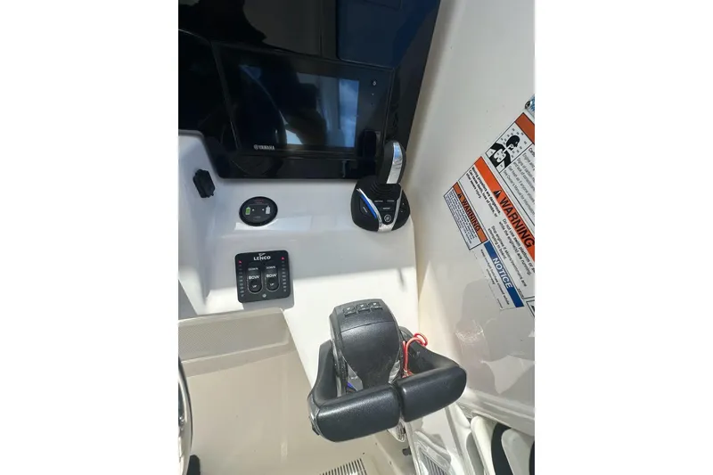 Slide: The Image of Control panel of 2022 Pursuit OS 325 Offshore boat with Yamaha display and warning labels. - 16
