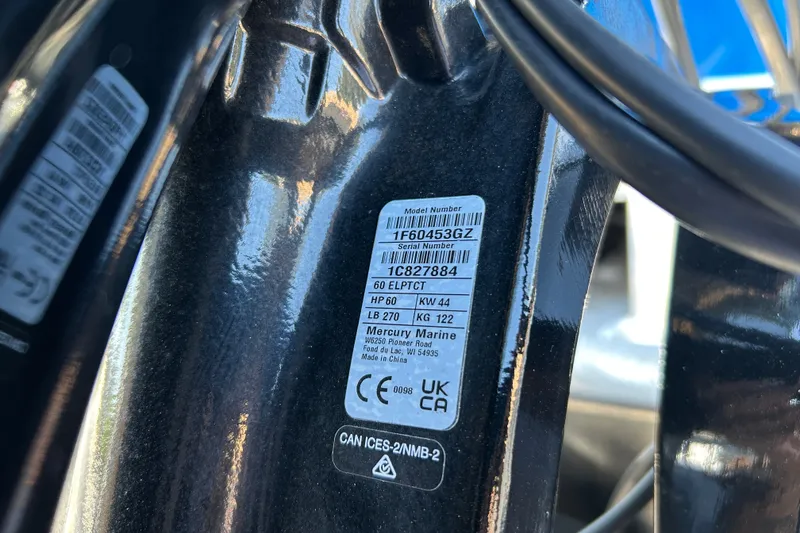 Slide: The Image of Label on a 2026 Sun Tracker Party Barge 18 DLX, displaying model and serial numbers. - 95