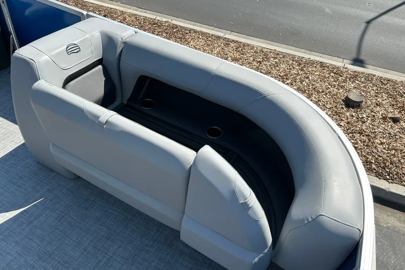 Slide: The Image of 2026 Sun Tracker Party Barge 18 DLX with gray seating and cup holders. - 14