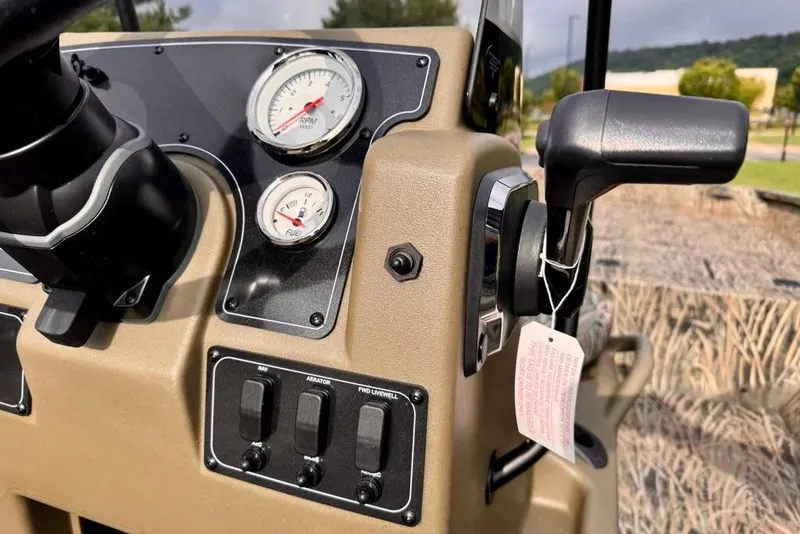 Slide: The Image of Dashboard of 2026 Tracker Grizzly 2072 CC boat with gauges and controls. - 13