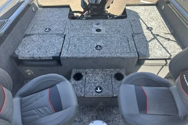 Slide: The Image of 2026 Tracker Targa V-19 Combo boat interior with gray seating and storage compartments. - 17