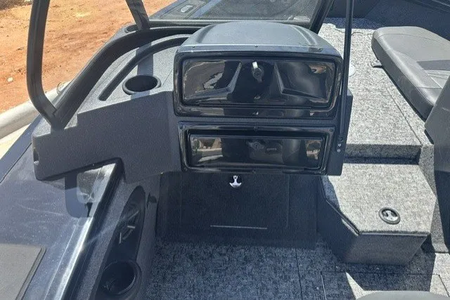 Slide: The Image of 2026 Tracker Targa V-19 Combo boat interior with dashboard and seating area. - 13