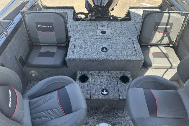 Slide: The Image of 2026 Tracker Targa V-19 Combo boat interior with gray seating and storage compartments. - 15