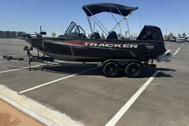 The Image of 2026 Tracker Targa V-19 Combo boat on trailer in parking lot. - 0