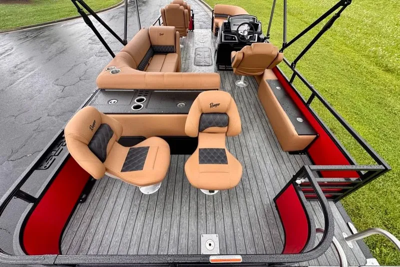 Slide: The Image of 2026 Ranger 223FC boat interior with tan seating and modern design. - 11