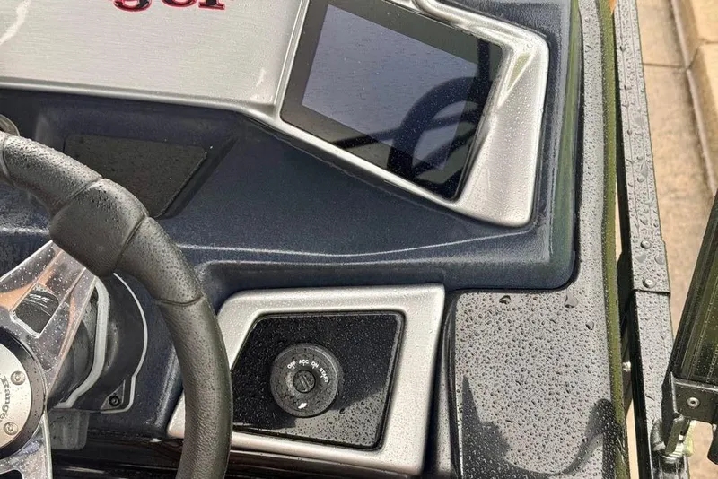Slide: The Image of Close-up of 2026 Ranger 223FC boat dashboard with steering wheel and control panel. - 9