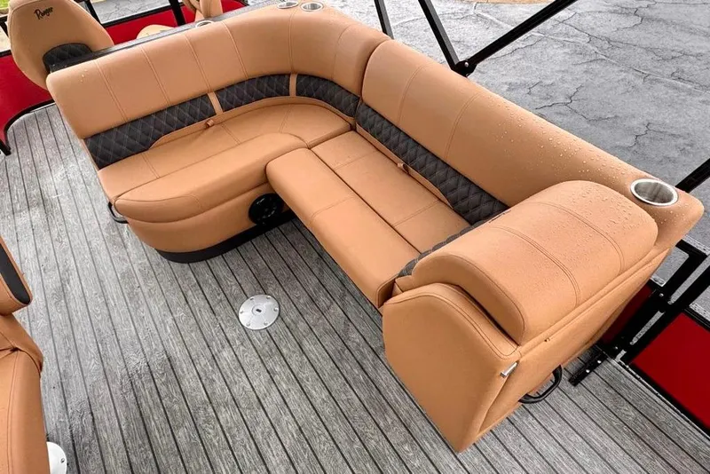 Slide: The Image of Luxurious seating on 2026 Ranger 223FC boat with tan upholstery and cup holders. - 13