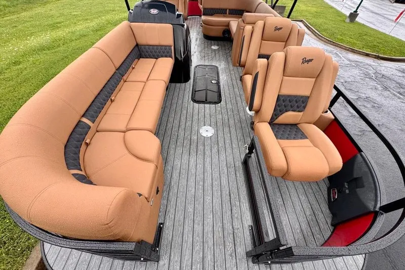Slide: The Image of 2026 Ranger 223FC boat interior with tan and black seating, featuring spacious layout and modern design. - 6
