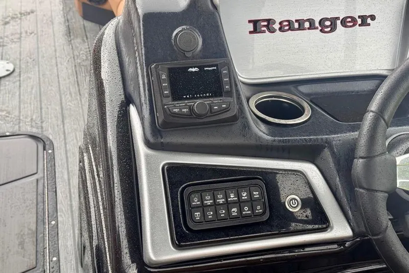 Slide: The Image of 2026 Ranger 223FC boat dashboard with controls and audio system. - 10