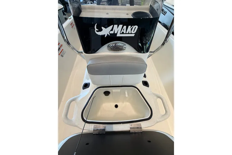 Slide: The Image of 2026 Mako Pro Skiff 17 CC boat interior with storage compartment and seating. - 8