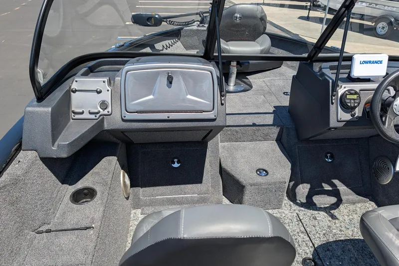 Slide: The Image of 2026 Tracker Pro Guide V-175 Combo boat interior with steering console and seating. - 9