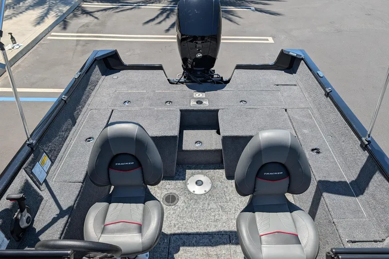 Slide: The Image of 2026 Tracker Pro Guide V-175 Combo boat interior with two seats and motor. - 7