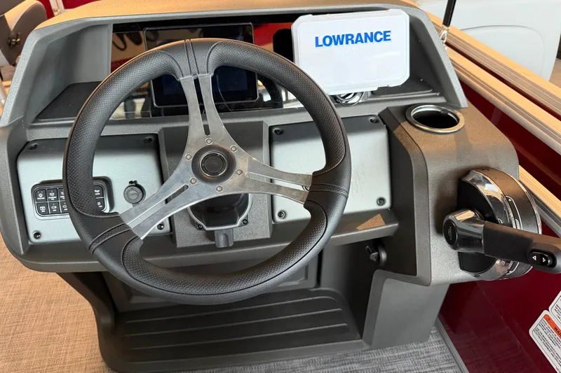 Slide: The Image of Steering console of 2026 Sun Tracker SportFish 20 DLX with Lowrance electronics. - 13
