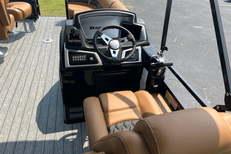 Slide: The Image of 2026 Ranger 220FC boat interior with steering wheel and tan seating. - 7