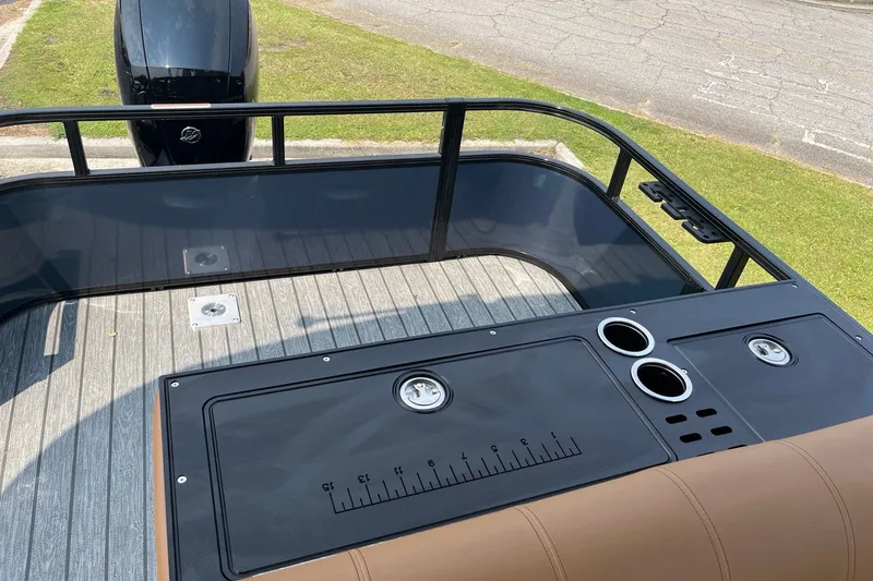 Slide: The Image of 2026 Ranger 220FC boat deck with motor, featuring a sleek design and functional layout. - 8