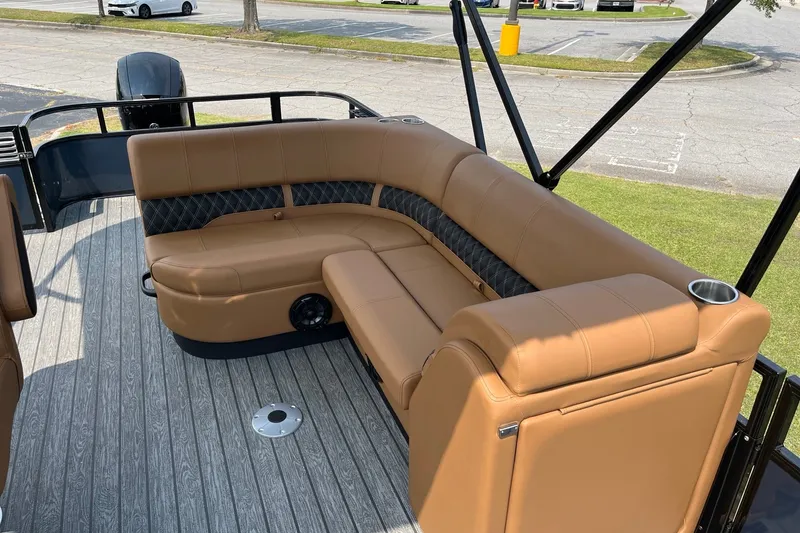 Slide: The Image of Luxurious seating on 2026 Ranger 220FC boat with tan upholstery and cup holders. - 9