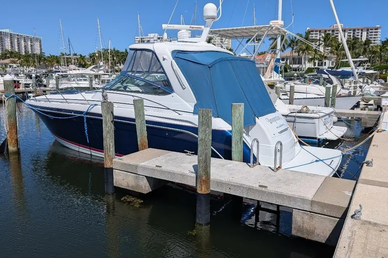 Slide: The Image of 2008 Formula 40 Performance Cruiser docked at a marina, surrounded by other boats. - 10