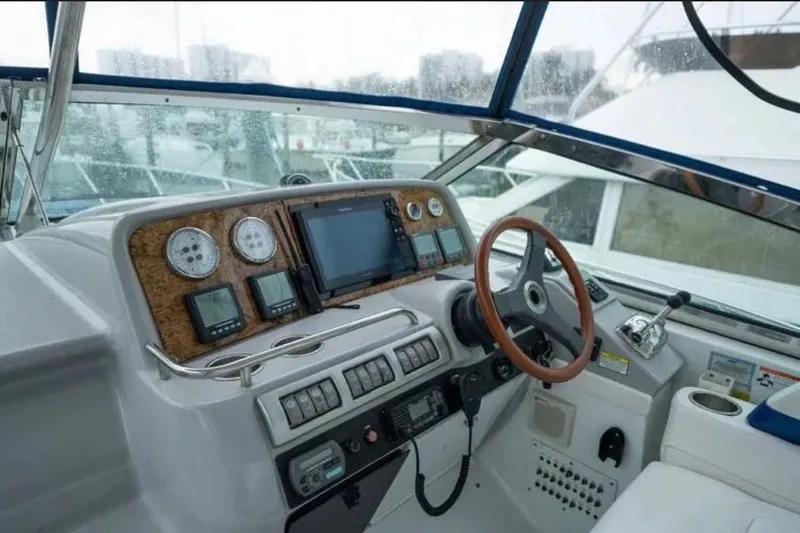 Slide: The Image of Cockpit of a 2008 Formula 40 Performance Cruiser with steering wheel and navigation instruments. - 12