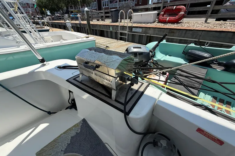 Slide: The Image of Outdoor grill on 2000 Mainship 390 Trawler boat deck, docked at marina. - 7