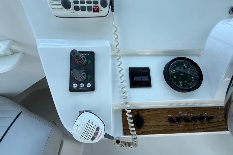 Slide: The Image of Control panel of a 2000 Mainship 390 Trawler with gauges and switches. - 41