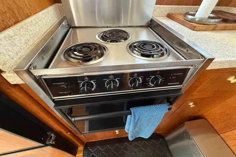 Slide: The Image of Stainless steel stove and oven in 2000 Mainship 390 Trawler kitchen. - 63