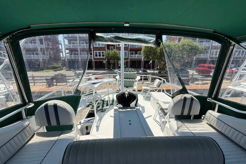 Slide: The Image of Interior view of 2000 Mainship 390 Trawler with seating and clear canopy. - 43