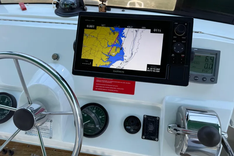 Slide: The Image of Helm of 2000 Mainship 390 Trawler with Garmin navigation display and controls. - 47