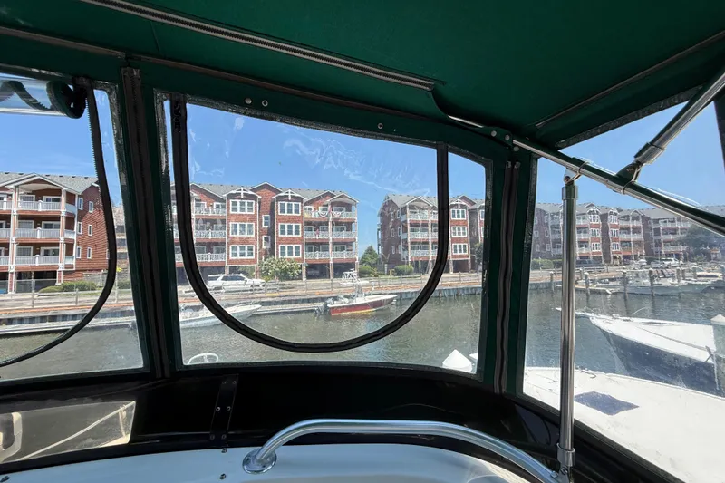 Slide: The Image of View from 2000 Mainship 390 Trawler, overlooking marina and waterfront buildings. - 37