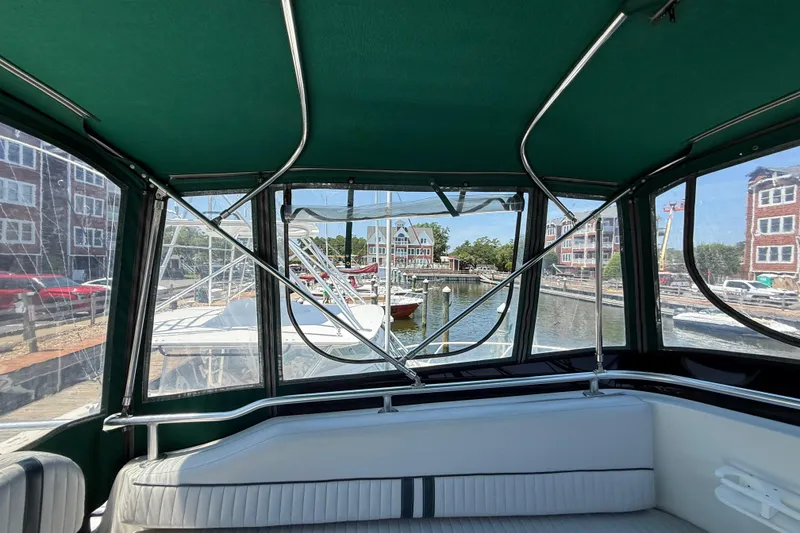 Slide: The Image of Interior view of 2000 Mainship 390 Trawler with marina backdrop. - 39