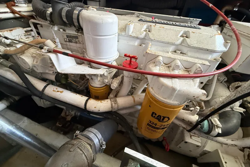 Slide: The Image of Engine compartment of a 2000 Mainship 390 Trawler with CAT filter visible. - 92