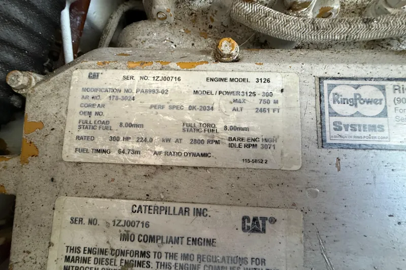 Slide: The Image of Caterpillar engine label on a 2000 Mainship 390 Trawler, model 3126, 300 HP. - 91