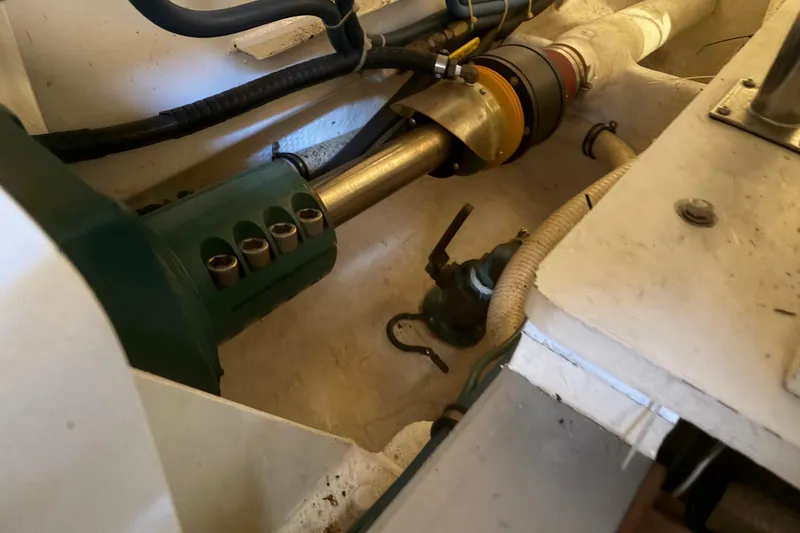 Slide: The Image of Engine compartment of a 2001 Grand Banks 42 Classic yacht, showcasing mechanical components. - 37