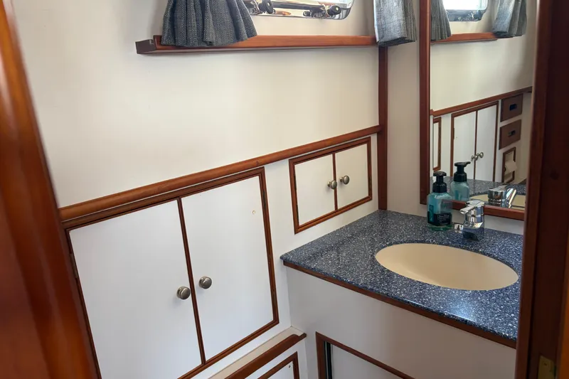 Slide: The Image of Bathroom interior of 2001 Grand Banks 42 Classic yacht with sink and storage cabinets. - 19