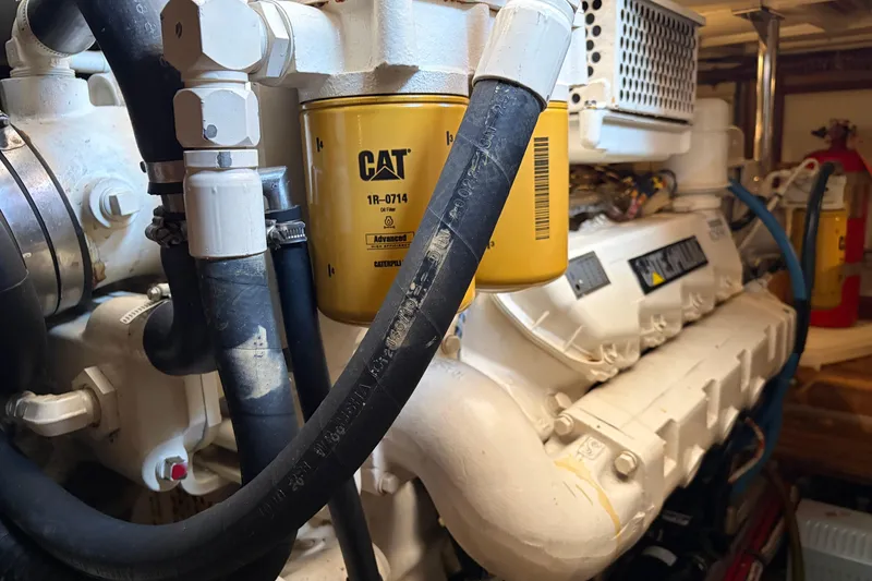 Slide: The Image of Engine room of 2001 Grand Banks 42 Classic with CAT oil filter visible. - 35
