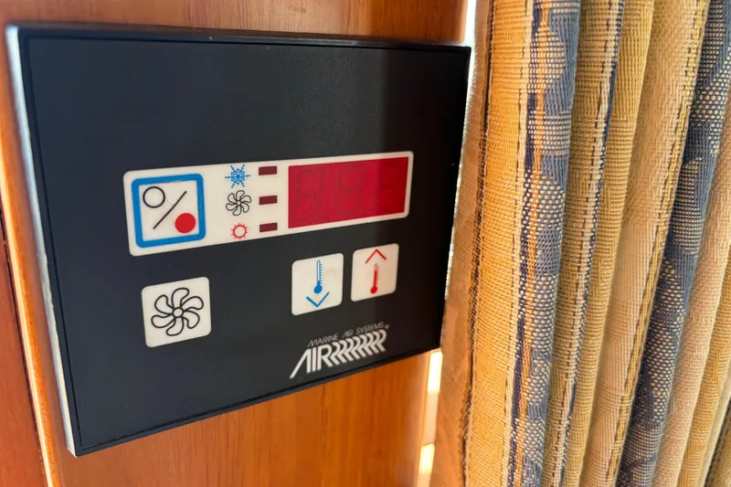 Slide: The Image of Control panel on 2001 Grand Banks 42 Classic yacht, featuring temperature and fan settings. - 40