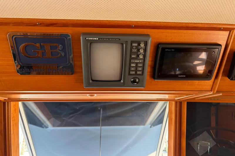 Slide: The Image of Control panel of a 2001 Grand Banks 42 Classic yacht with navigation equipment. - 10