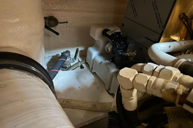 Slide: The Image of Engine room of 2001 Grand Banks 42 Classic with visible pipes and machinery. - 38