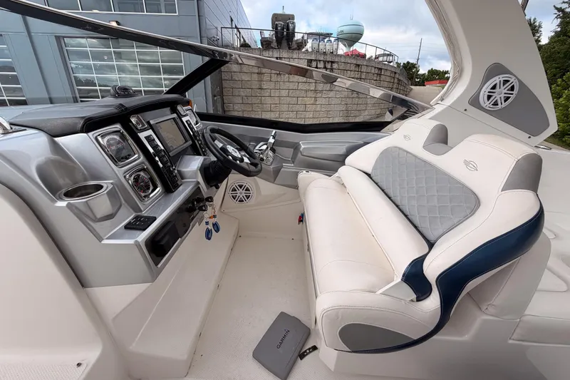 Slide: The Image of 2012 Chaparral 327 SSX boat interior with modern dashboard and luxurious seating. - 13